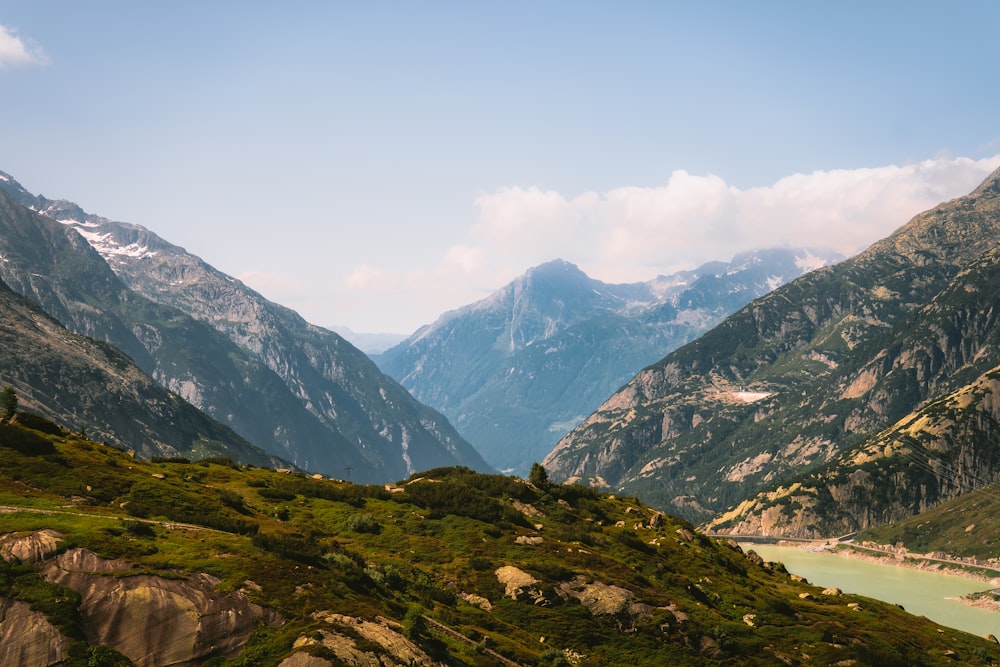 a view of a valley with mountains in the background