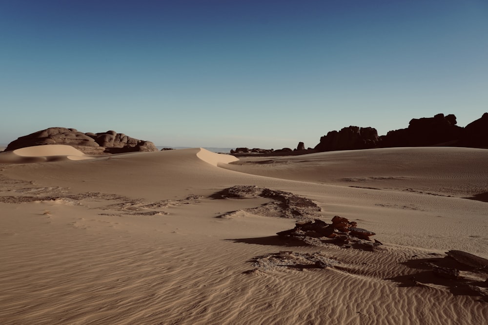 a desert landscape with rocks and sand