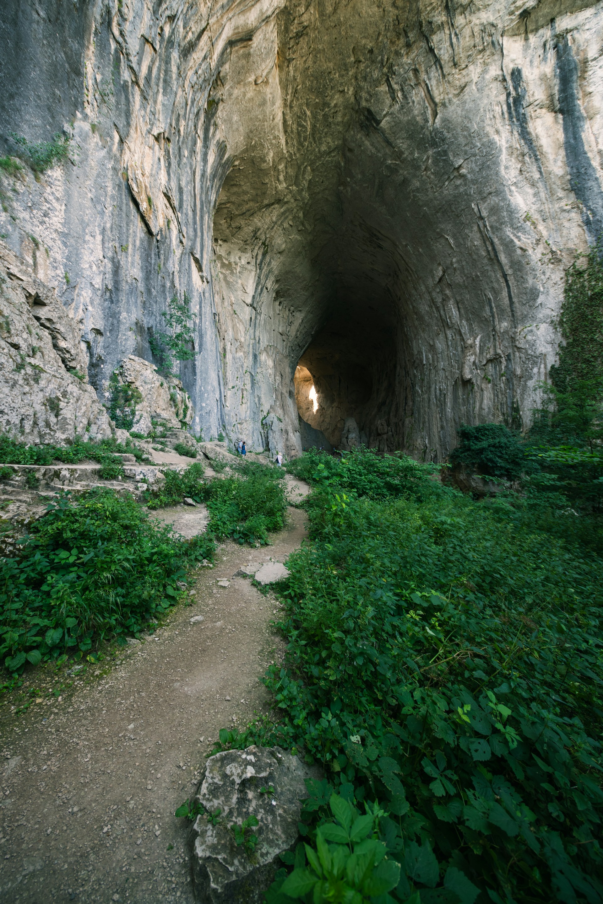 woman wearing yellow long-sleeved dress under white clouds and blue sky during daytime
