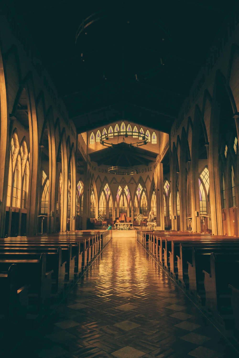 a church with pews and stained glass windows