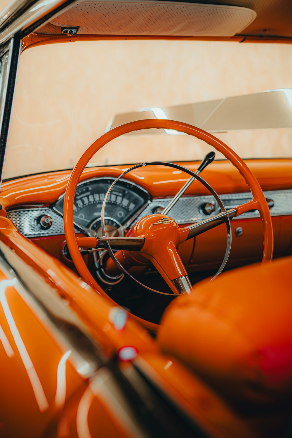 the interior of an old car with a steering wheel