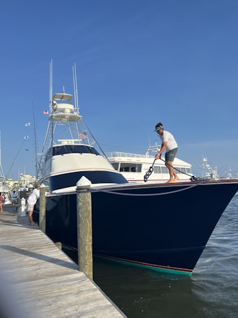 a man standing on a boat in the water