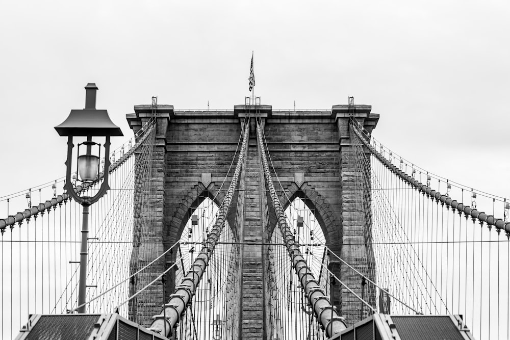 a black and white photo of the brooklyn bridge