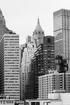 Modern Dubai skyline in grayscale with a focus on high-rise residential buildings.
