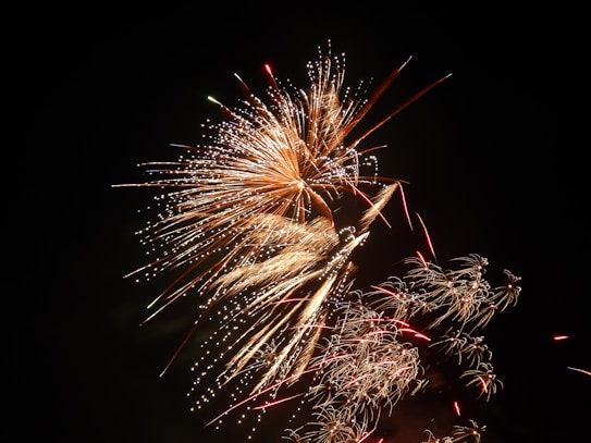 Brilliant fireworks display in the night sky, featuring an array of vibrant and colorful bursts with an impressive array of sparkles and streaks.