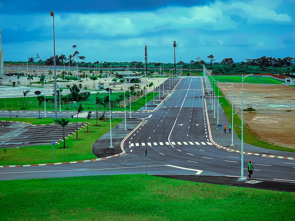 a long empty street with a sky background