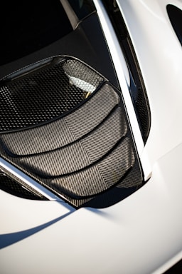 A modern automotive parts contact form with a carbon fiber design.