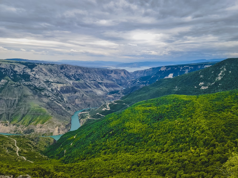 a scenic view of a valley with a river running through it