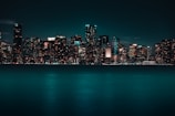 a city skyline is lit up at night