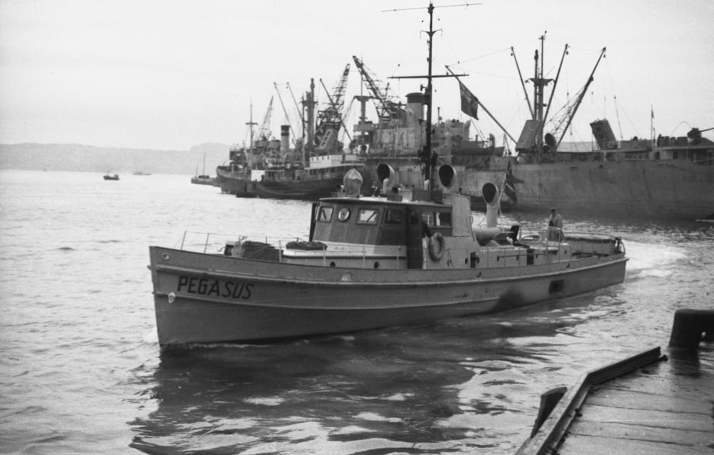 a black and white photo of a boat in the water