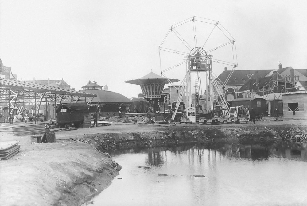 a black and white photo of a ferris wheel