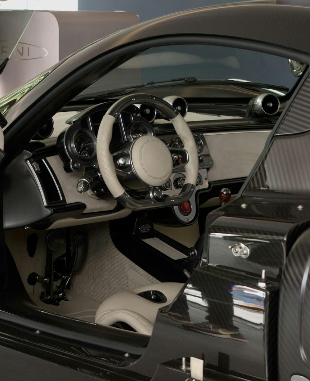 the interior of a car with a steering wheel