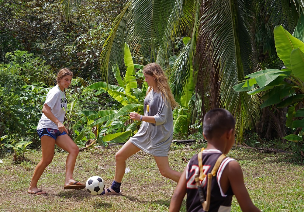 a group of young people playing a game of soccer