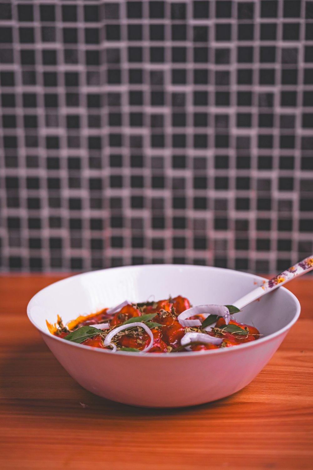 a bowl of soup with a spoon in it