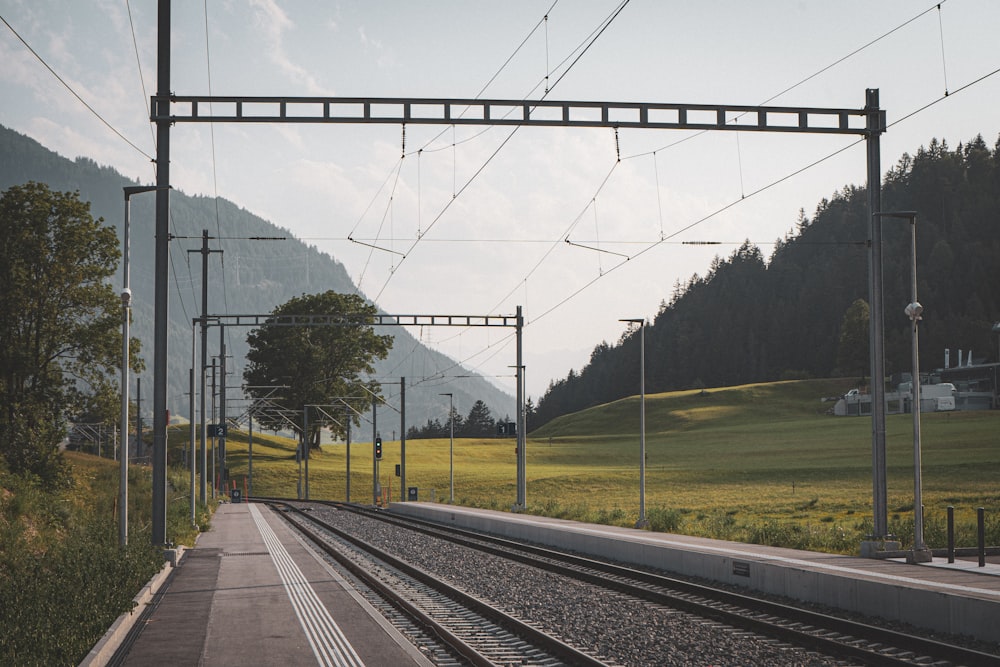 a train station with a train on the tracks