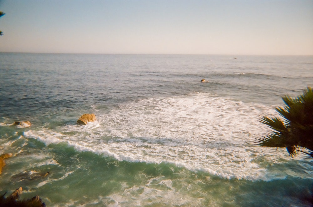 a body of water with waves coming in to shore