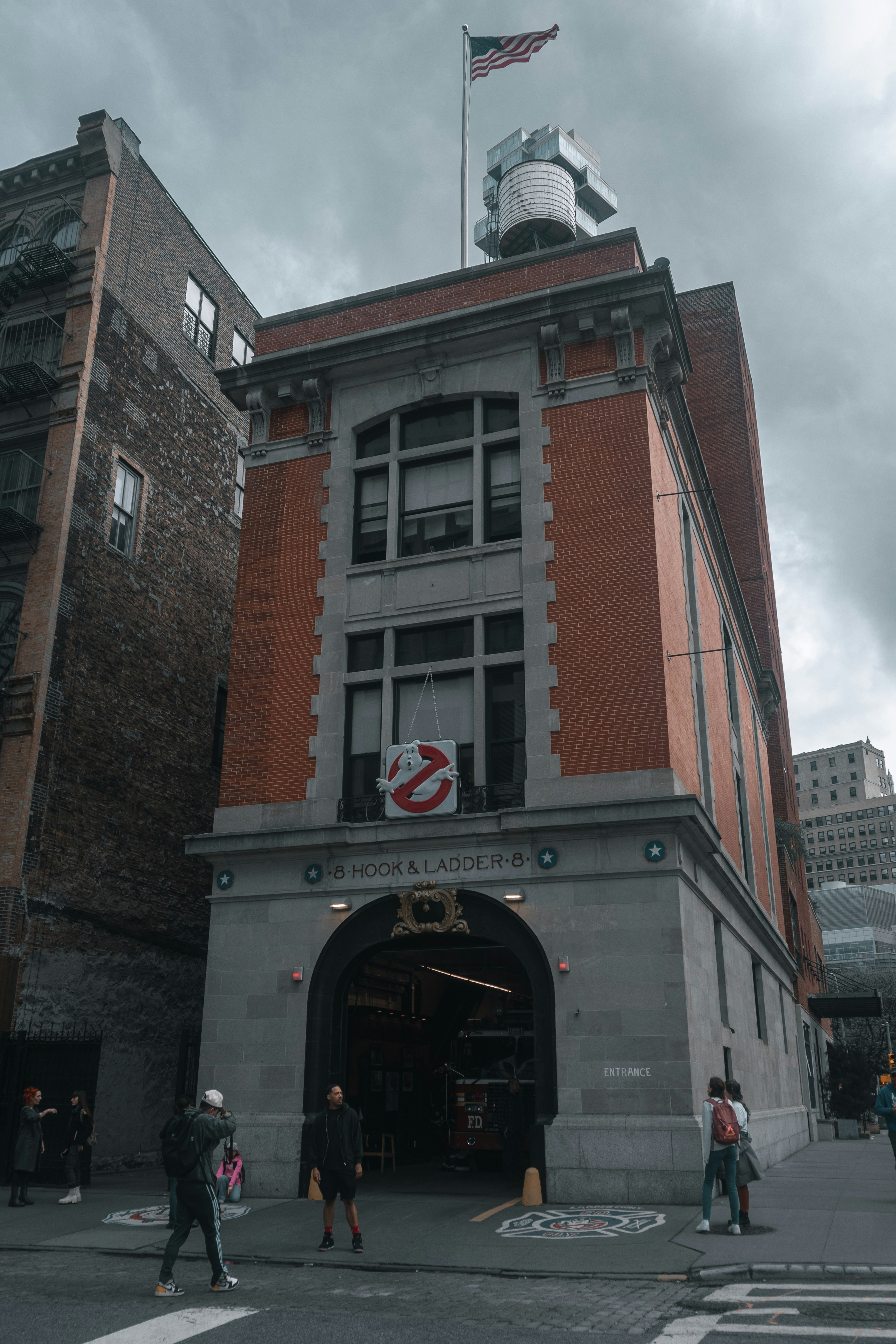 a tall building with a flag on top of it