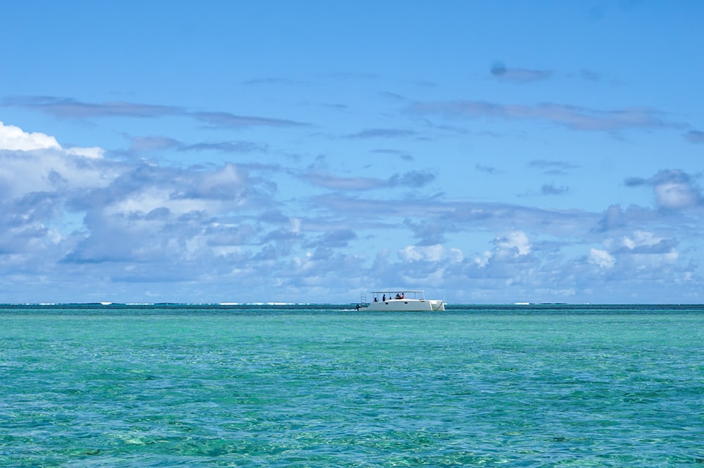 a boat floating on top of a large body of water