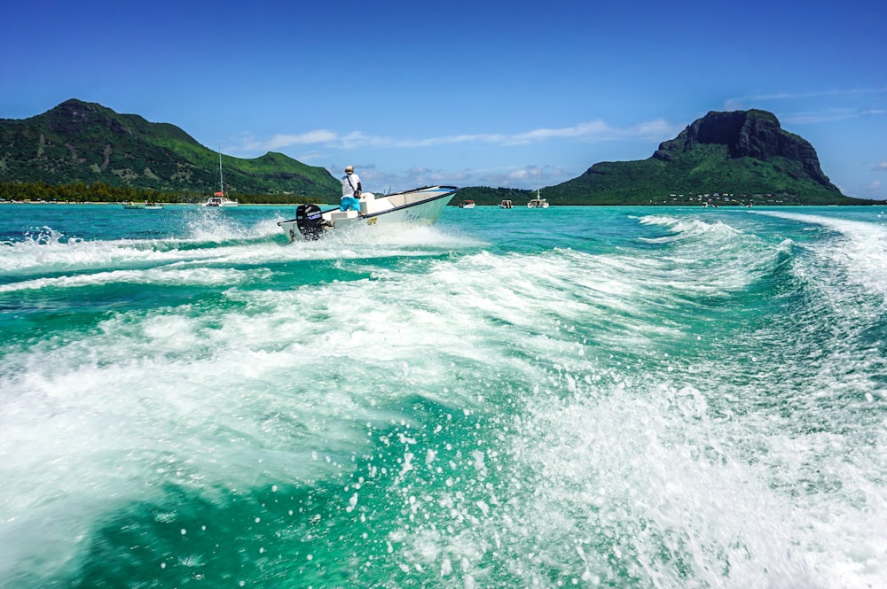 a man riding a jet ski on top of a body of water