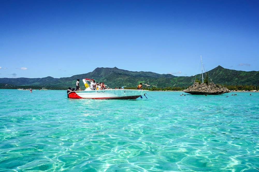 a small boat in the middle of a body of water