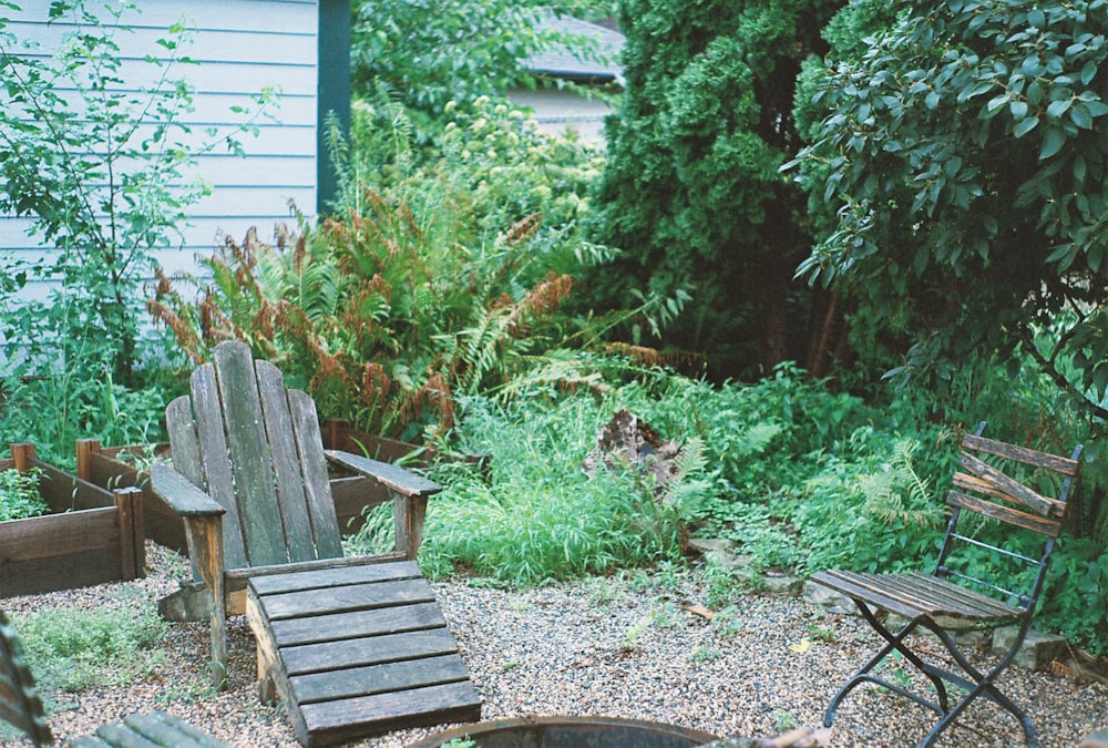 a couple of lawn chairs sitting next to a fire pit