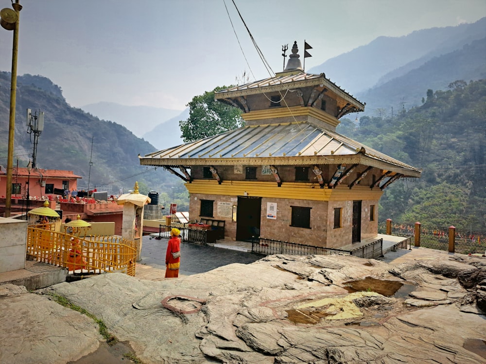 a small wooden building sitting on top of a mountain