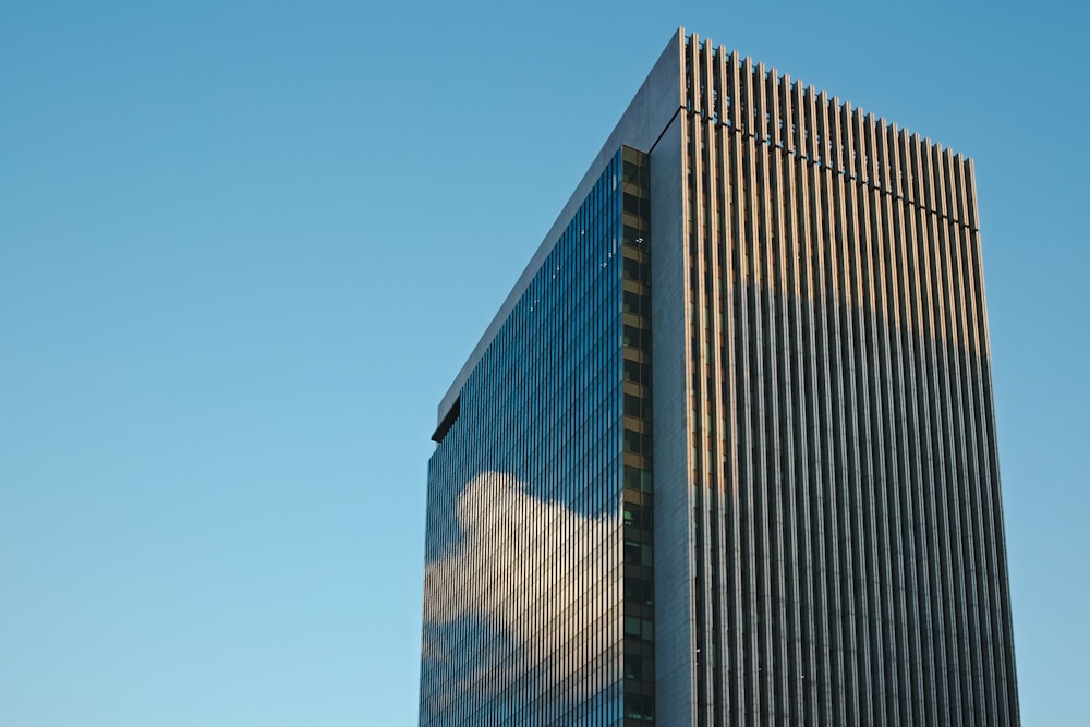 a very tall building with a sky background