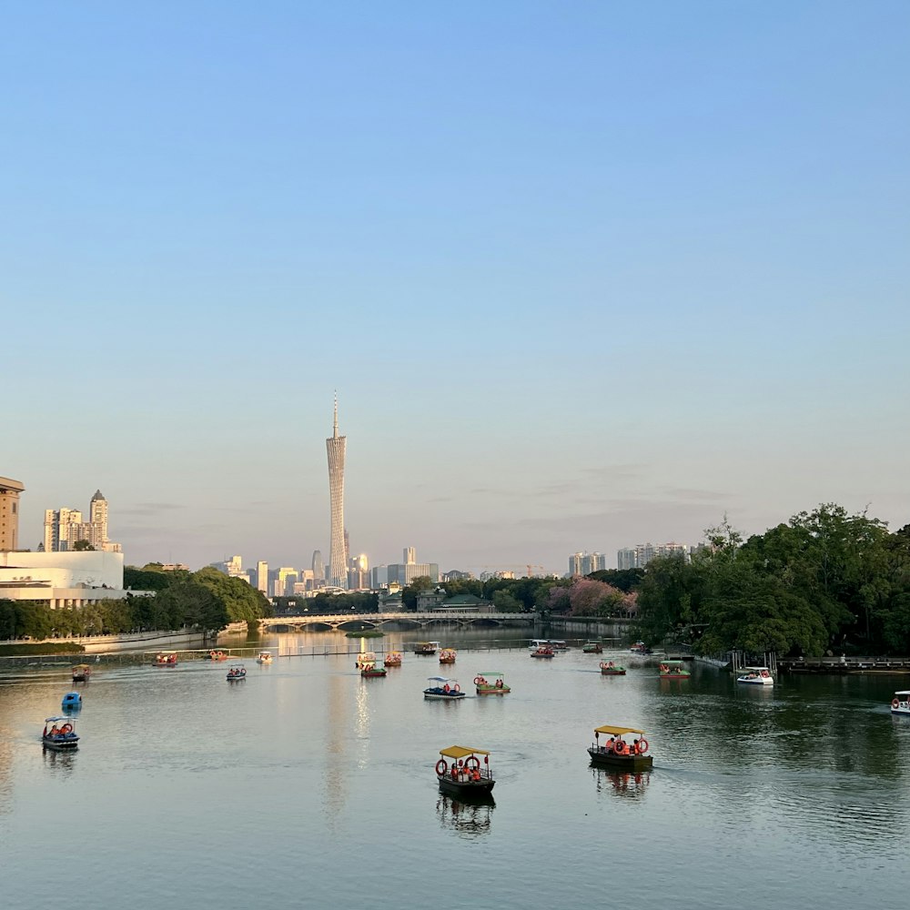 a group of boats floating on top of a river