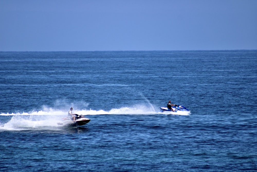 a person on a jet ski being pulled by a boat