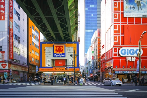 a city street filled with lots of tall buildings