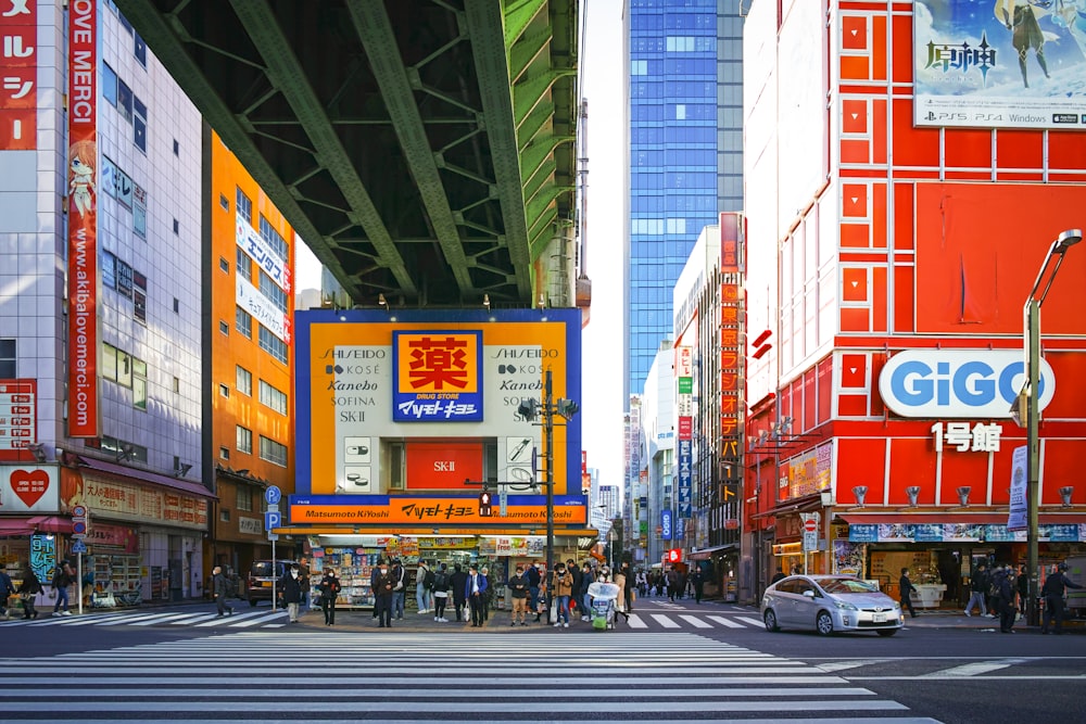 a city street filled with lots of tall buildings