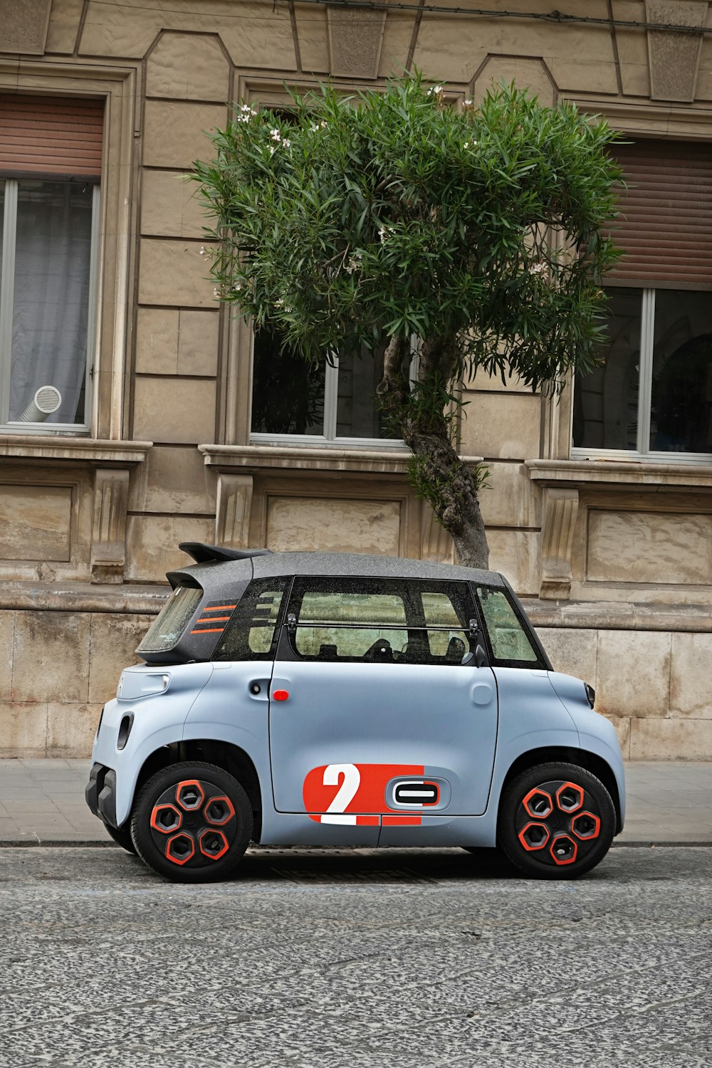 a small car parked on the side of the road