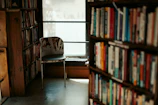 Cozy nook with books and soft pillows, perfect for a quiet afternoon.