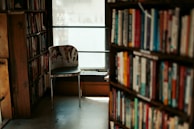 A cozy reading nook with stacks of quinne & co press children's books and soft natural light.