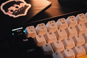 Close-up of a keyboard with Windows and Linux stickers.