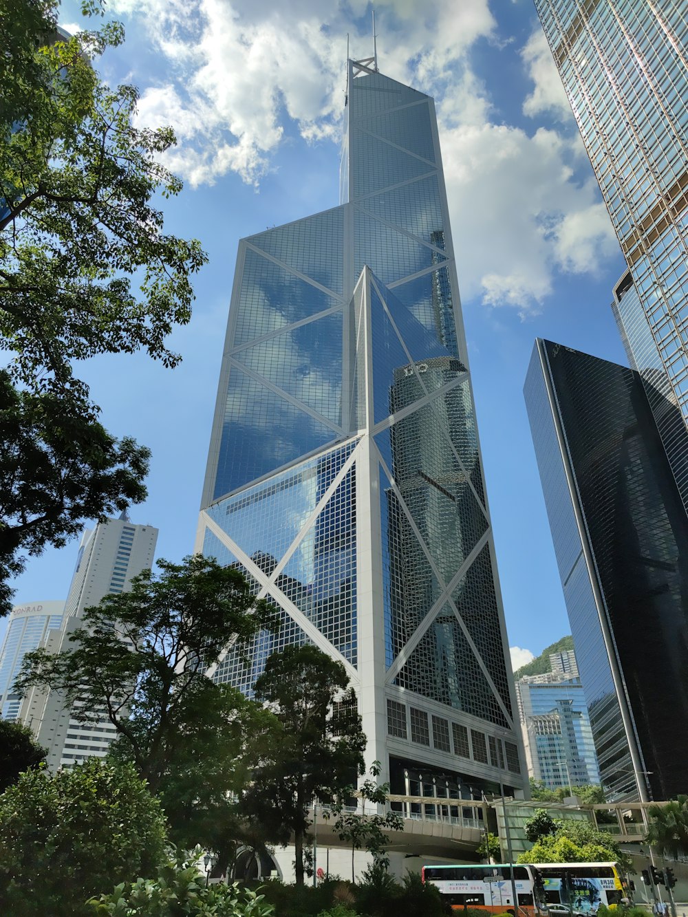 a very tall building surrounded by other tall buildings