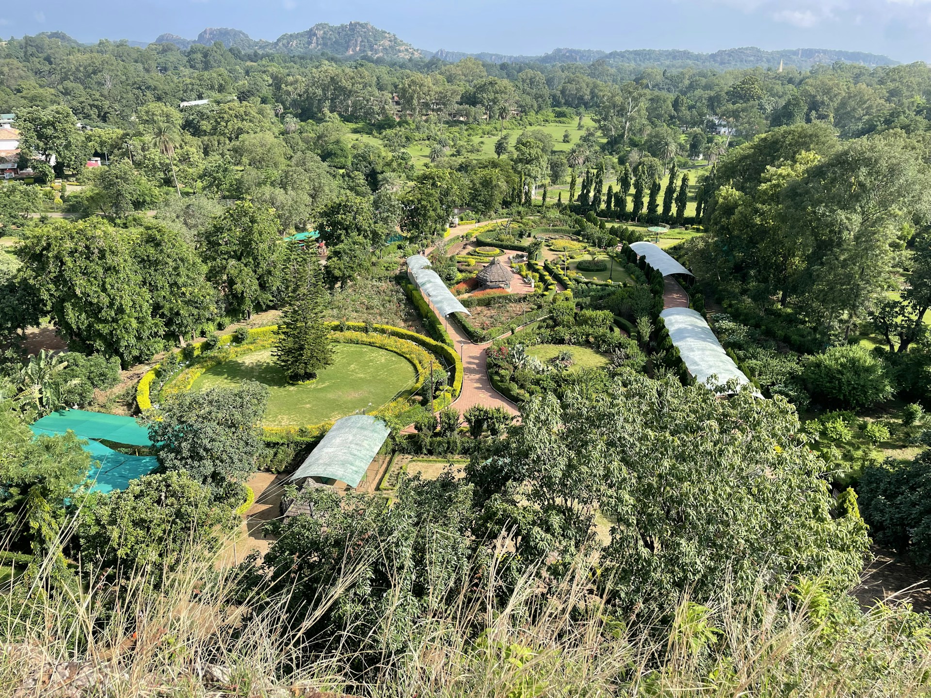 woman wearing yellow long-sleeved dress under white clouds and blue sky during daytime