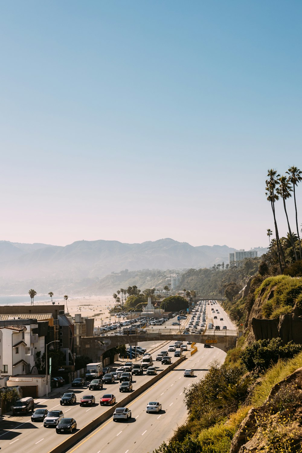 a view of a highway with cars driving on it