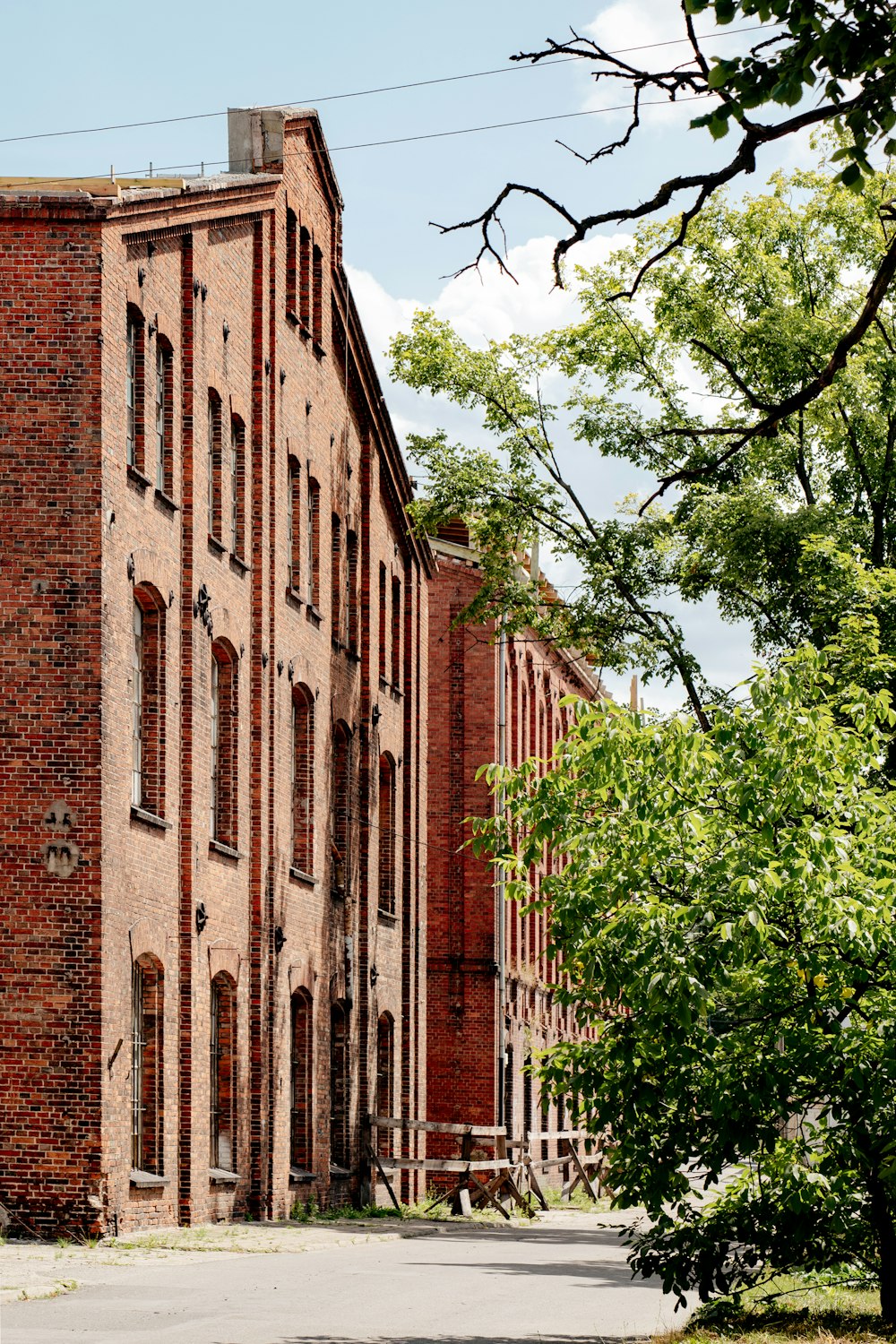 a brick building with a clock on the side of it