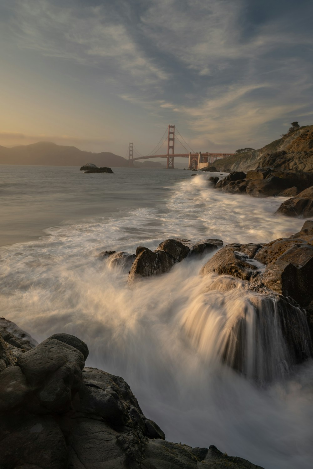 a large body of water near a large bridge