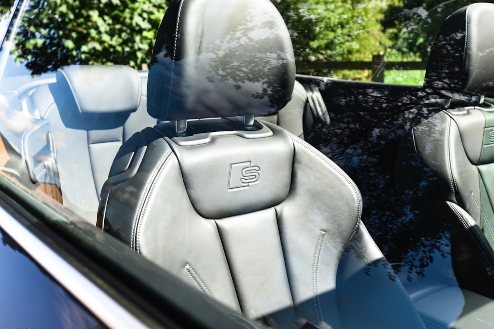 the interior of a car with the sunroof down