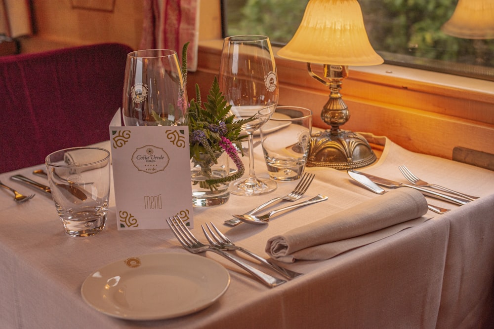 a table set for a formal dinner in a restaurant