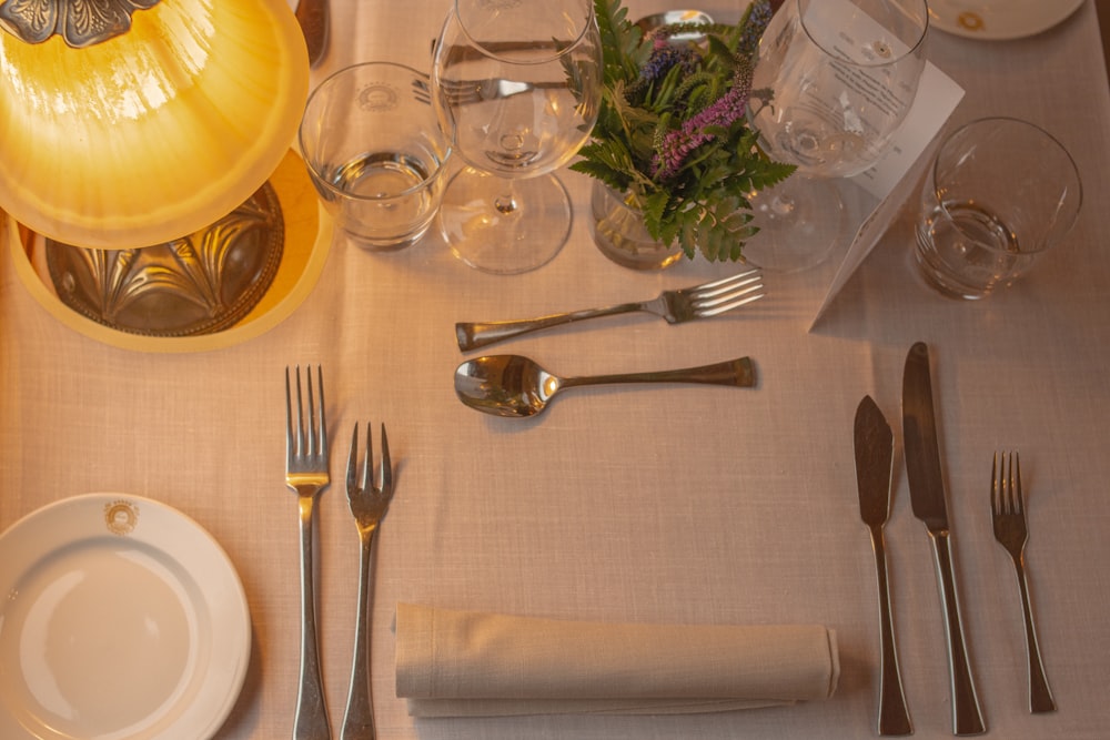 a table is set with silverware and silverware