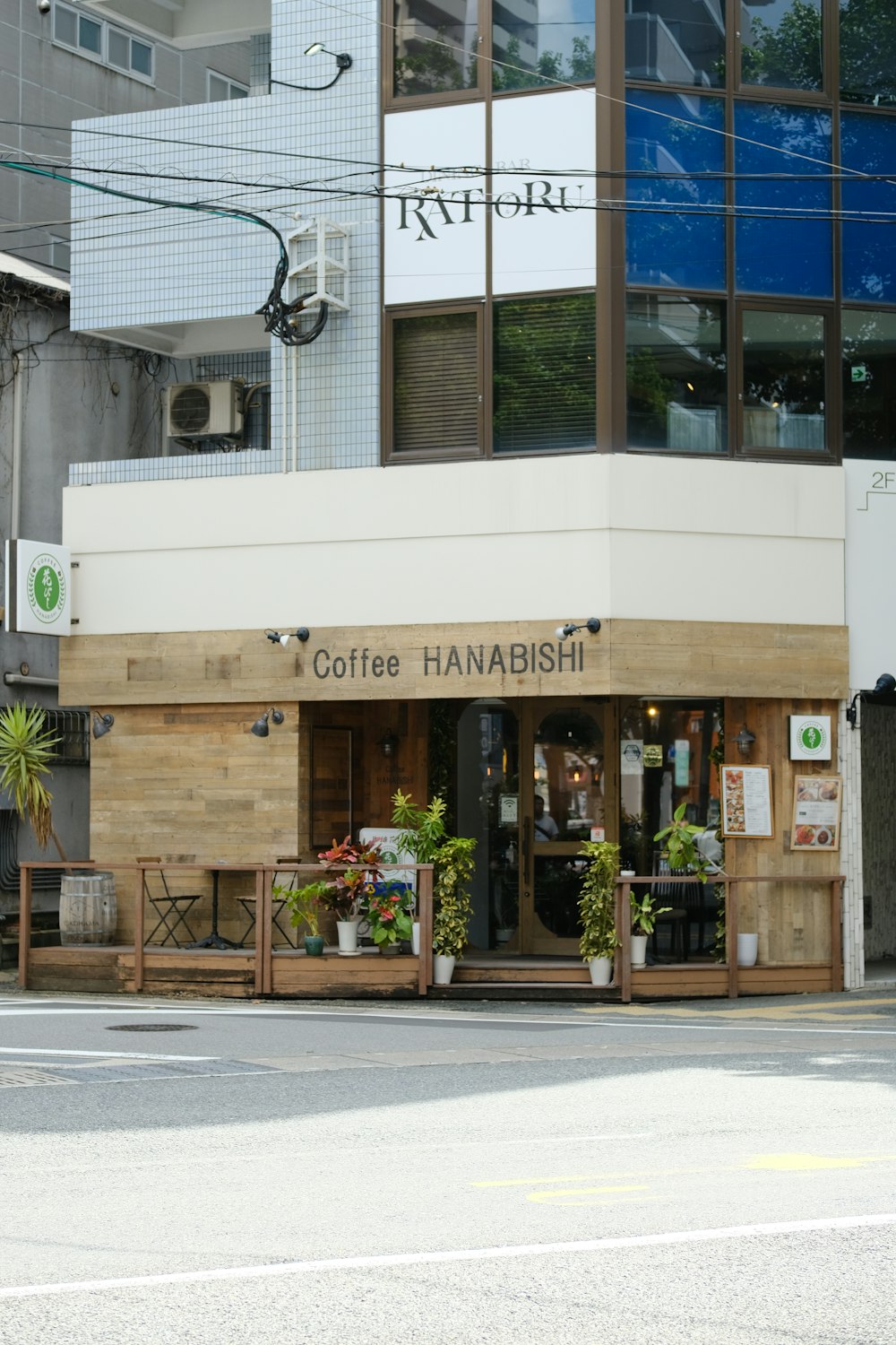 a coffee shop on the corner of a city street