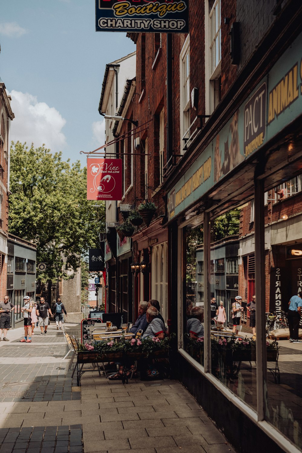 a city street lined with shops and people