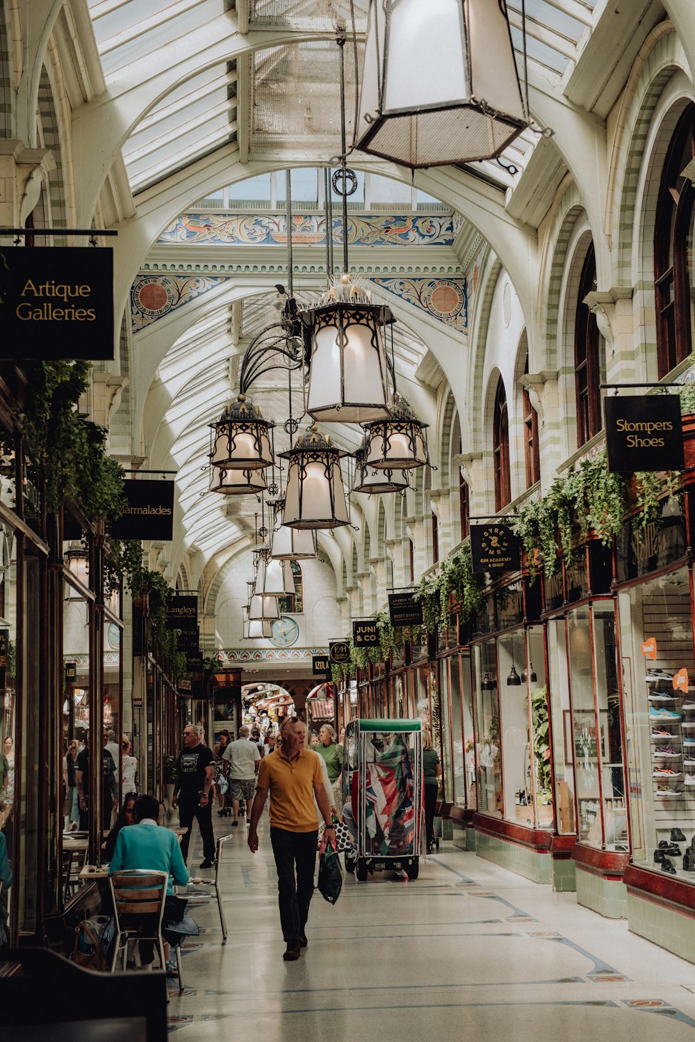 a man is walking down a shopping mall