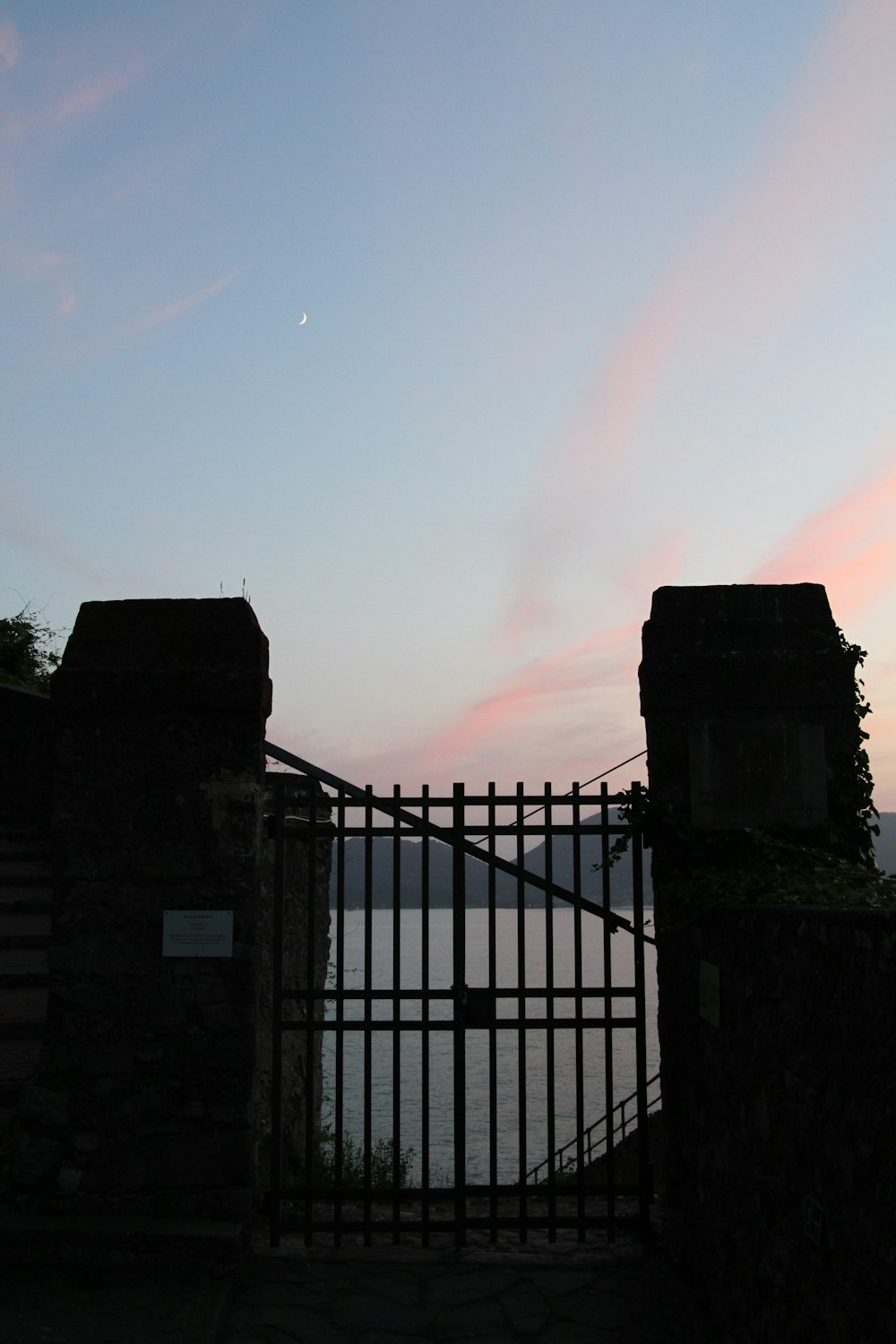 a gate that is next to a body of water