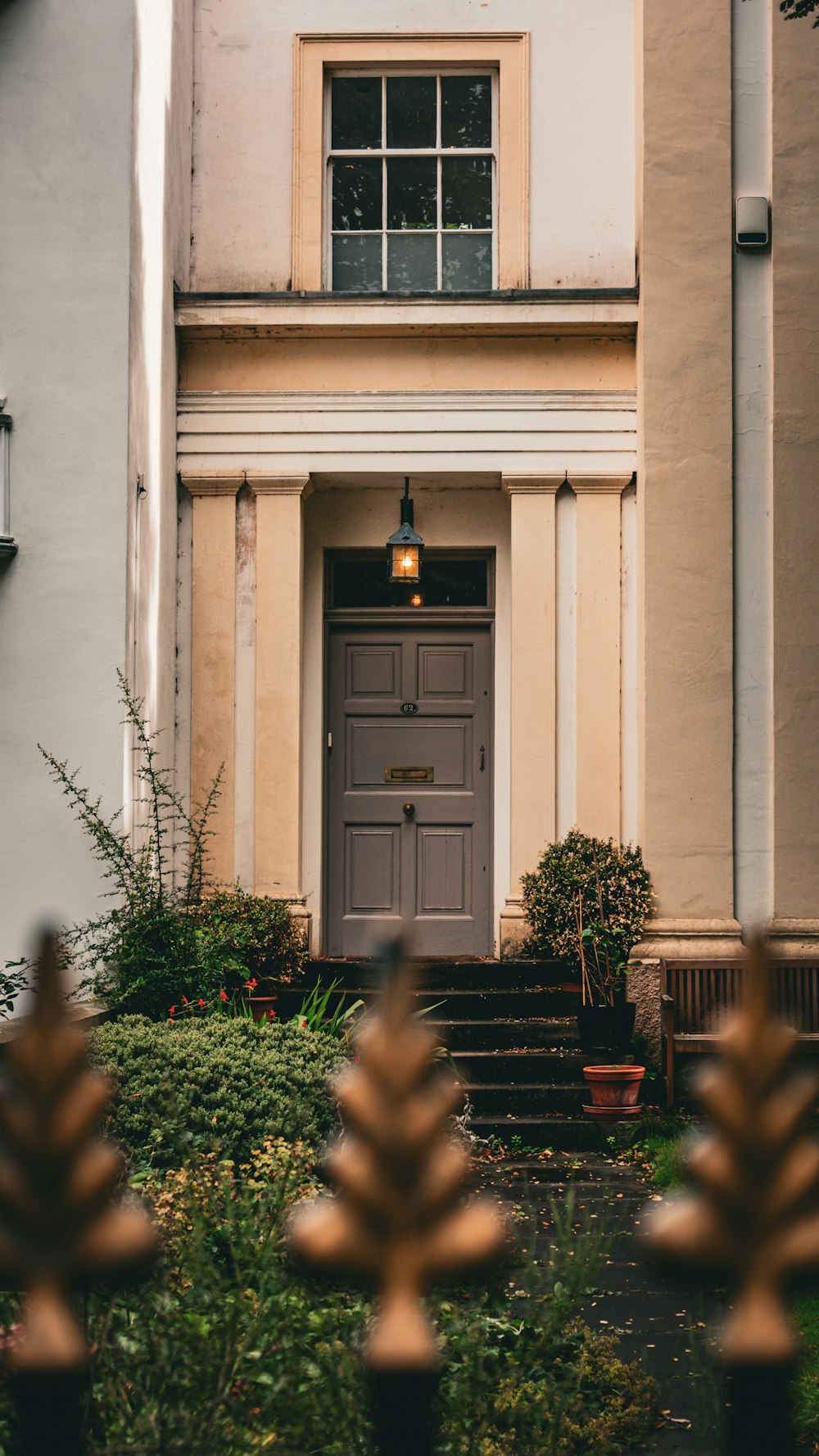 the front of a house with a brown door