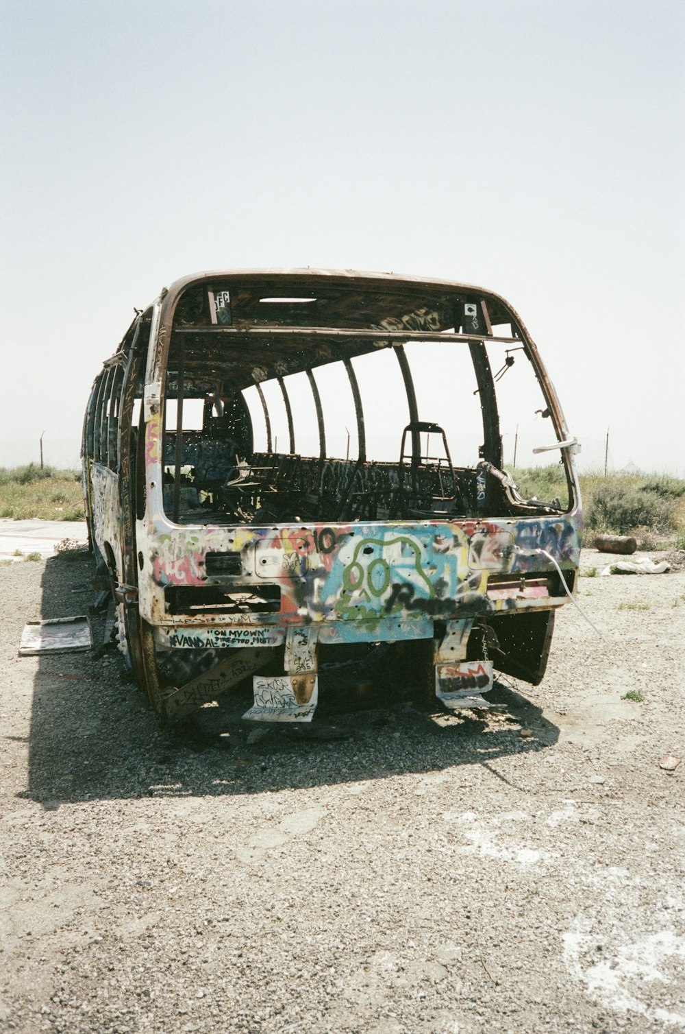 an old bus that has been vandalized with graffiti