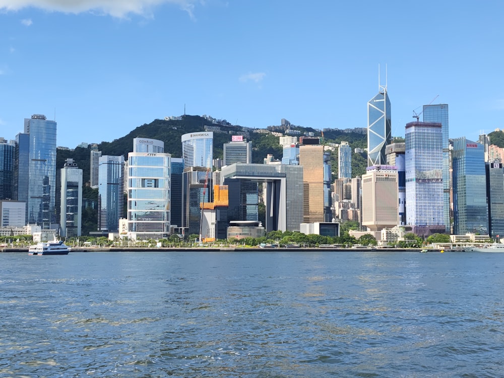 a large body of water with a city in the background